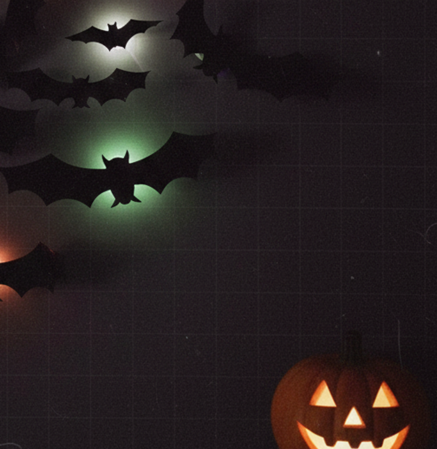 Glow Bats next to a carved pumpkin