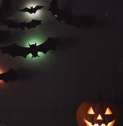 Glow Bats next to a carved pumpkin
